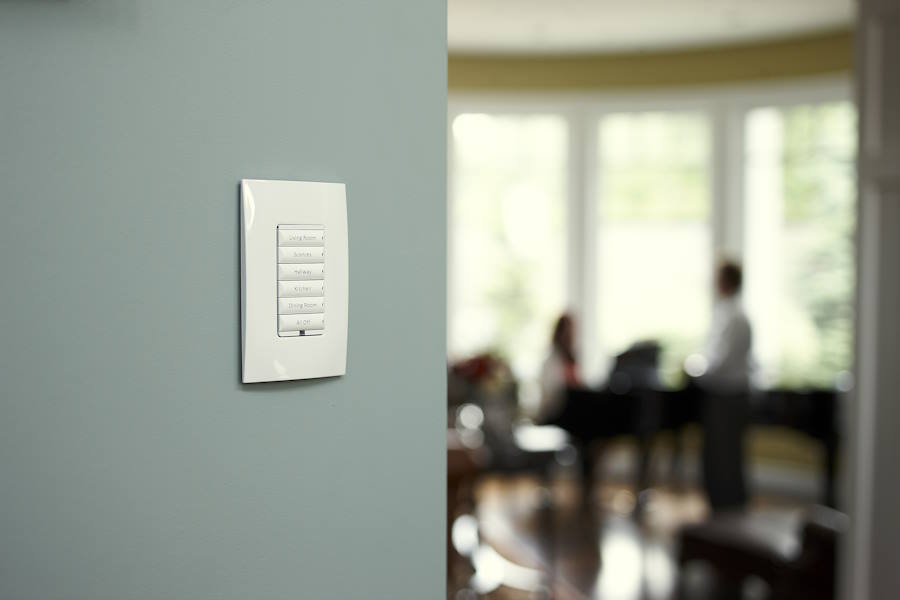 Control4 touch panel on wall above light switches